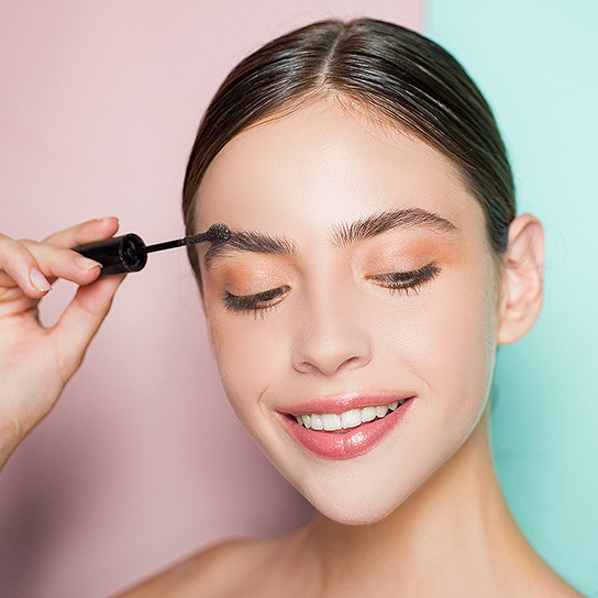 Woman learning to shape and style eyebrows